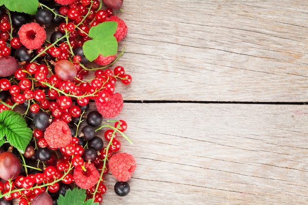 Fresh ripe berries on wooden table