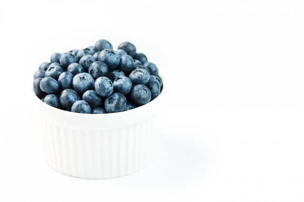 Fresh ripe blueberries in a white bowl