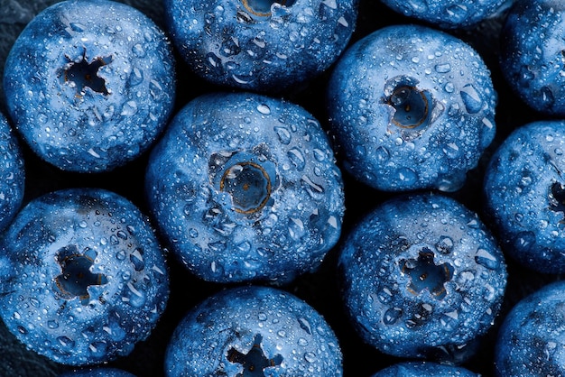 Fresh ripe blueberries with water drops macro photo berry background