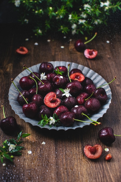 Fresh ripe cherries on metal plate