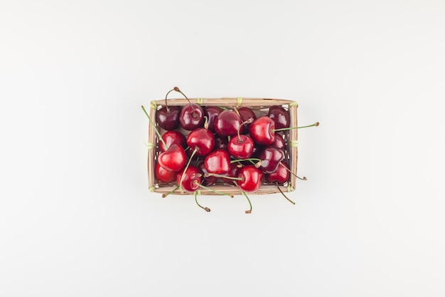 Fresh ripe cherry in a small wicker basket