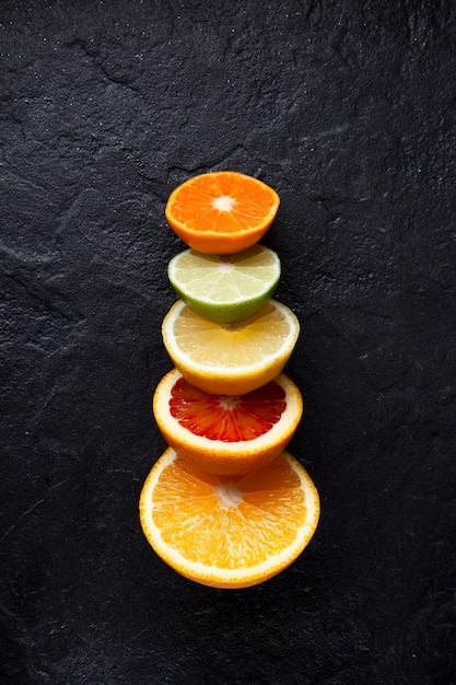 Fresh ripe citrus fruits cut in half