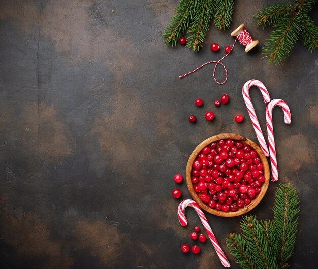 Fresh ripe cranberry in wooden bowl