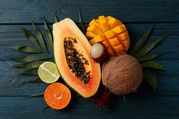 Fresh ripe exotic fruits on wooden background.