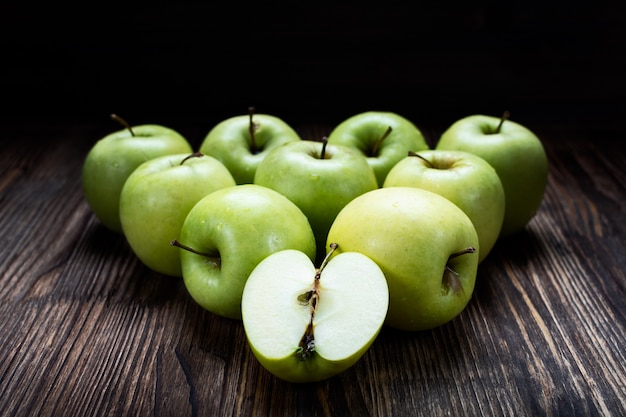 Fresh ripe green apples on a wooden table