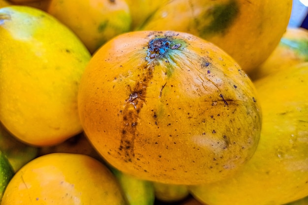 Photo fresh ripe juicy sliced mango on a white background, isolated, closeup