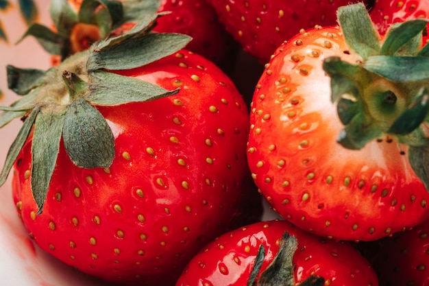 Fresh ripe juicy strawberries in a bowl closeup