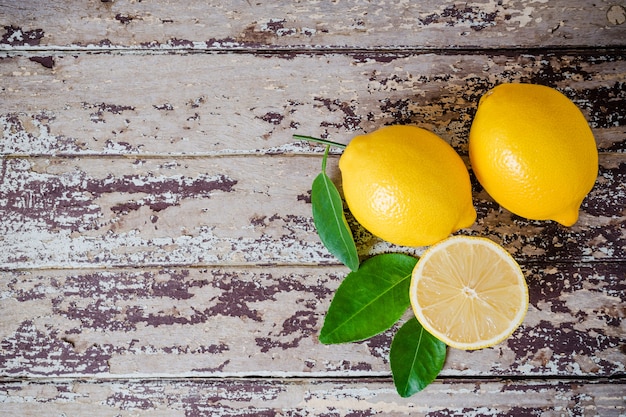 Fresh ripe lemons on wooden table