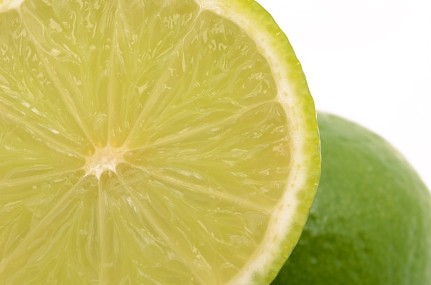 Fresh ripe lime on a white surface isolated