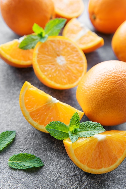 Fresh ripe oranges on concrete background