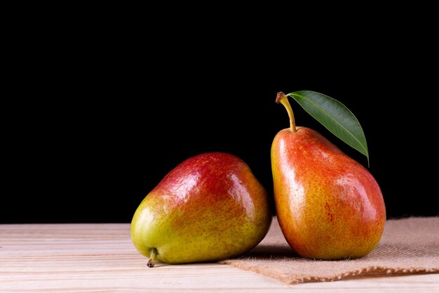 Fresh ripe organic pears on rustic wooden table