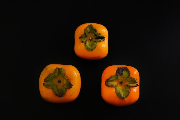 Fresh ripe Persimmon or Chinese date plum persimmon photo