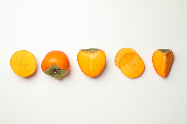 Fresh ripe persimmon on white background, top view