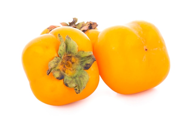 Fresh ripe persimmons isolated on white background