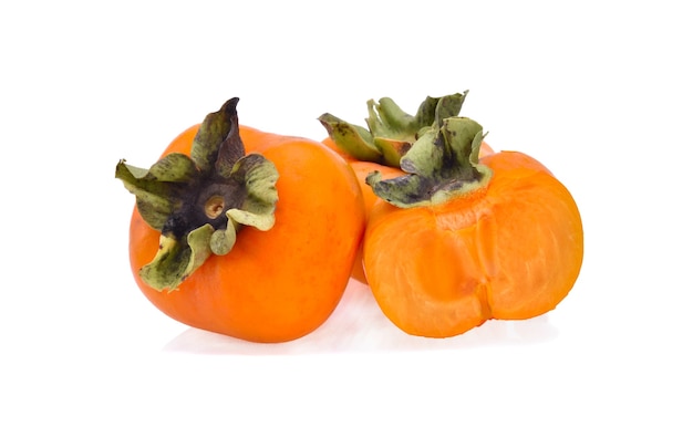 Fresh ripe persimmons isolated on white surface