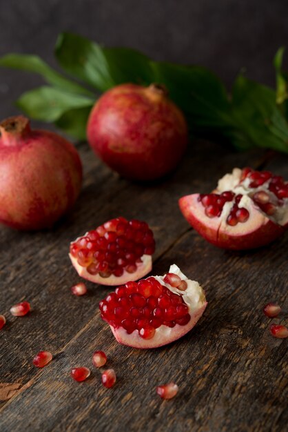 Fresh ripe pomegranate on a wooden, selective focus