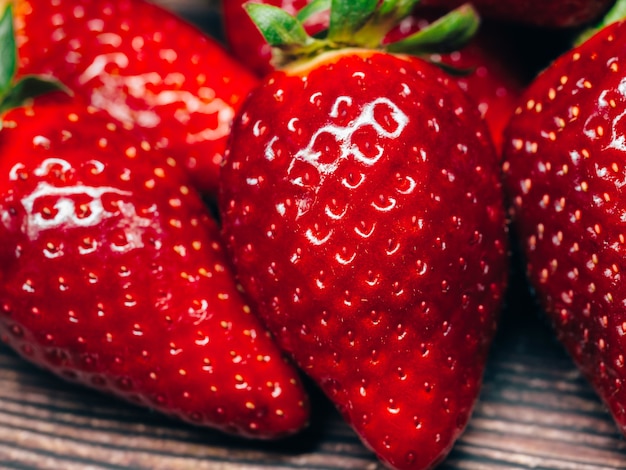 Fresh ripe and red strawberry berries close up