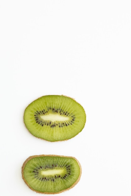 Fresh and ripe sliced kiwi on the white background