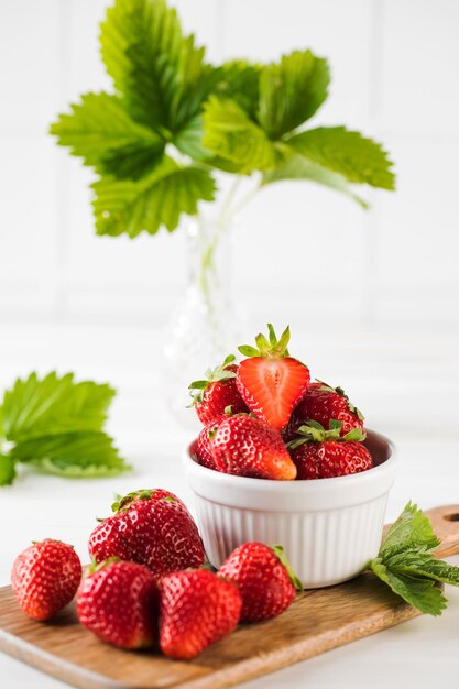 Fresh ripe strawberries on a wooden board Summer