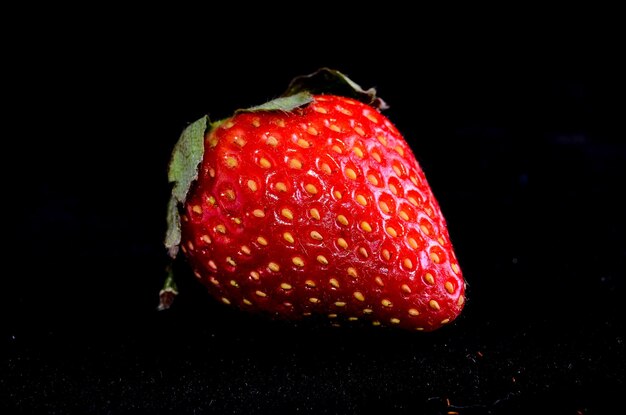 Fresh Ripe Strawberry Fruit on a Black Background