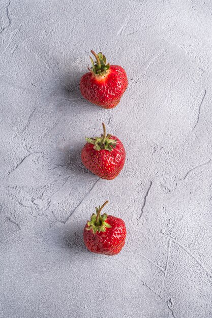 Fresh ripe strawberry fruits in row