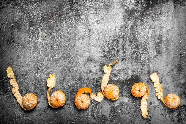 Fresh ripe tangerines on a rustic background