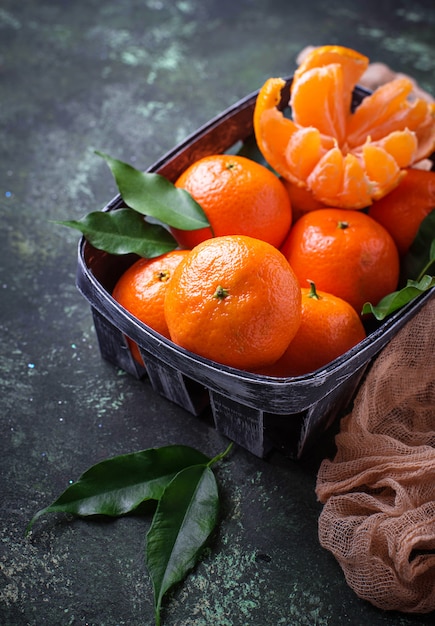 Fresh ripe tangerines with leaves