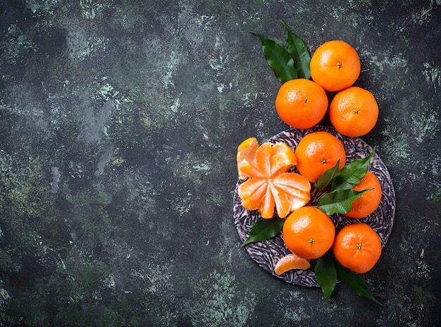 Fresh ripe tangerines with leaves