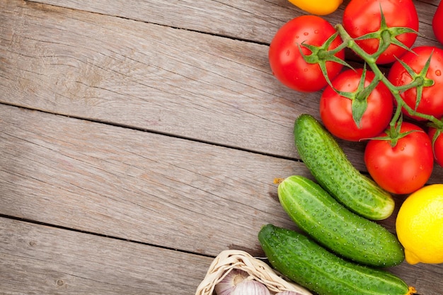 Fresh ripe vegetables on wooden table