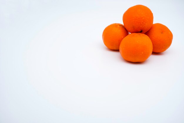 Fresh and ripe whole oranges isolated on white background with copy space