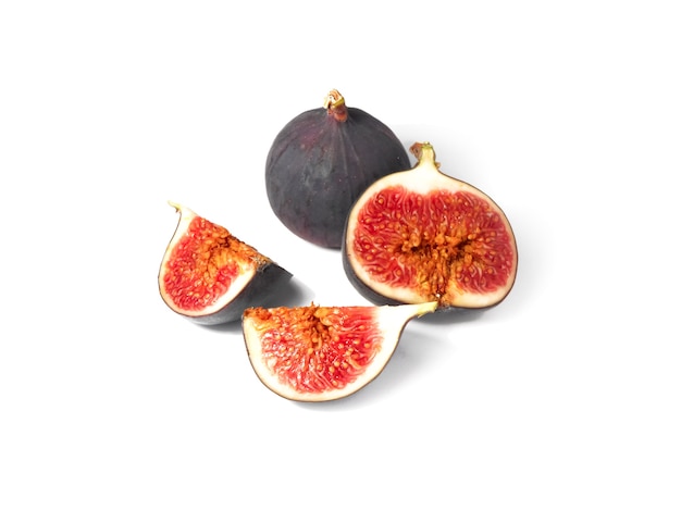 Fresh ripe whole and sliced figs on a white background