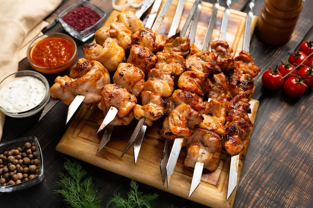 Fresh roast chicken shish kebab on rustic wooden