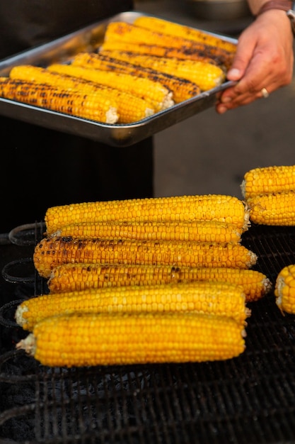 Fresh roasted or grilled corncobs. Grilled Corn for sale on the street.