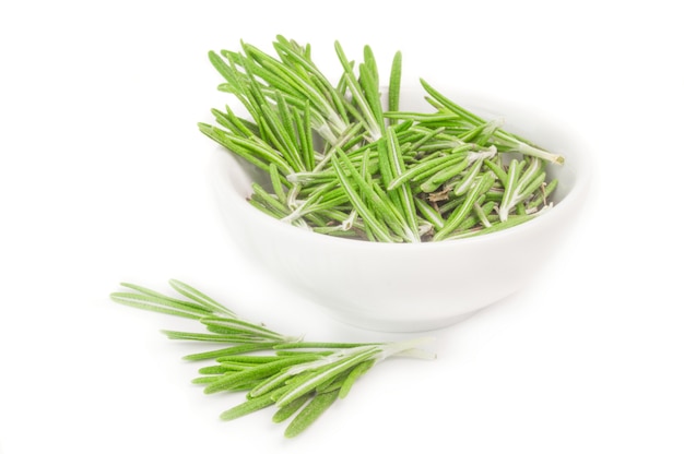 Fresh rosemary in a bowl isolated on white cutout