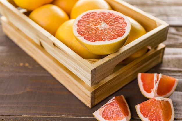 Fresh ruby red grapefruits in wood crate.