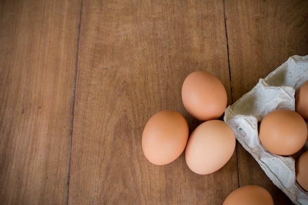 Fresh rural eggs on a wooden board