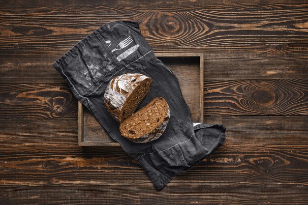 Fresh rye brown bread on wooden cutting board