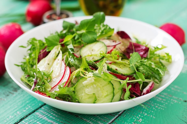 Fresh salad of cucumbers, radishes and herbs