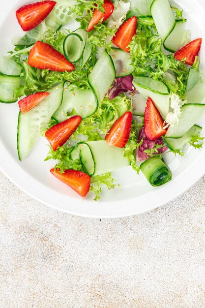 fresh salad strawberry cucumber lettuce diet meal food snack on the table copy space food