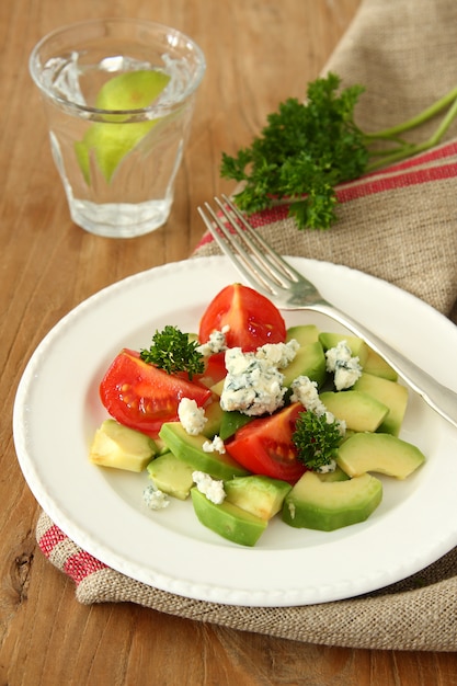 Fresh salad with avocado, tomato and cheese