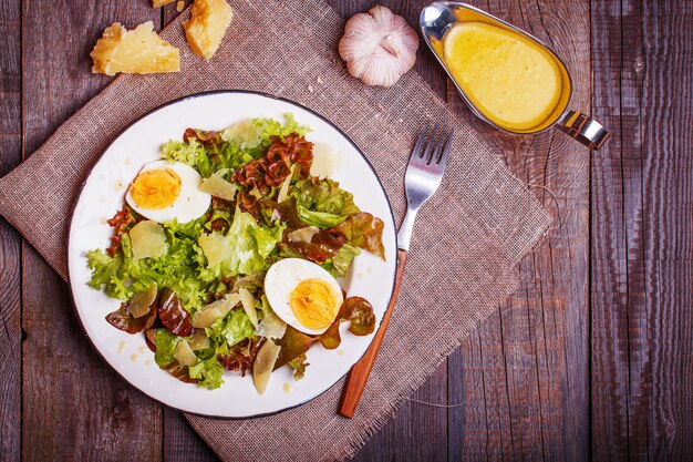 Fresh salad with egg and parmesan cheese