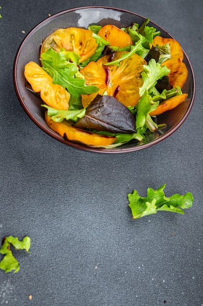 fresh salad yellow tomato green leaf lettuce healthy meal food snack on the table copy space food