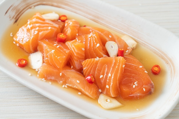 fresh salmon raw marinated shoyu or salmon pickled soy sauce - Asian food style