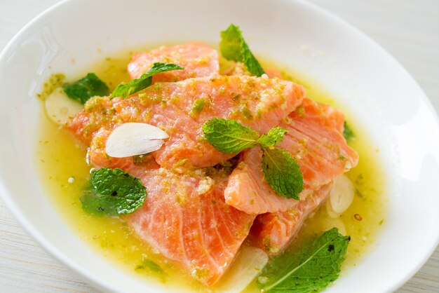 fresh salmon raw with spicy seafood salad sauce