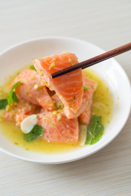 fresh salmon raw with spicy seafood salad sauce