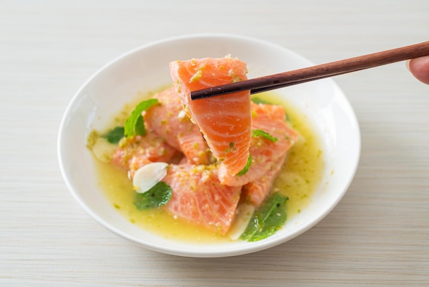 fresh salmon raw with spicy seafood salad sauce