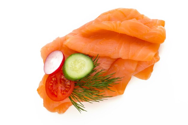 Fresh salmon slice and spice on the white surface.