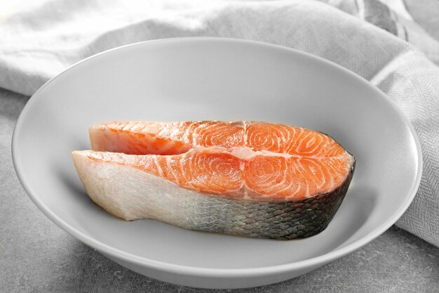 Fresh salmon steak in plate