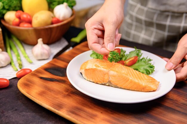 Fresh Salmon steak with salad. Online learning for cooking diet and healthy food when stay at home during Coronavirus.