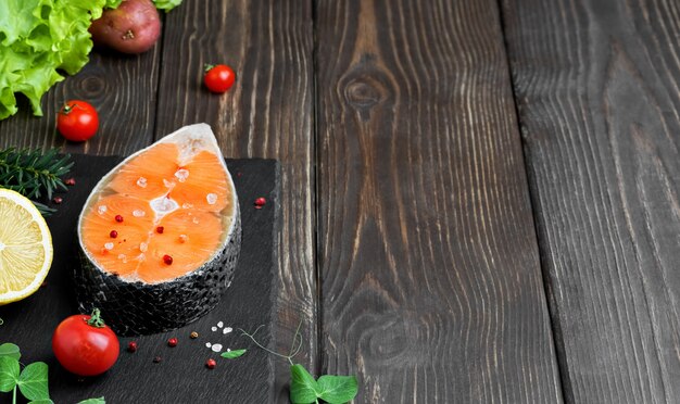 Fresh salmon steak with salt and red pepper